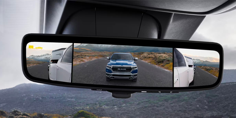 Front mirror reflecting 2025 RAM 3500 near Princeton, IL